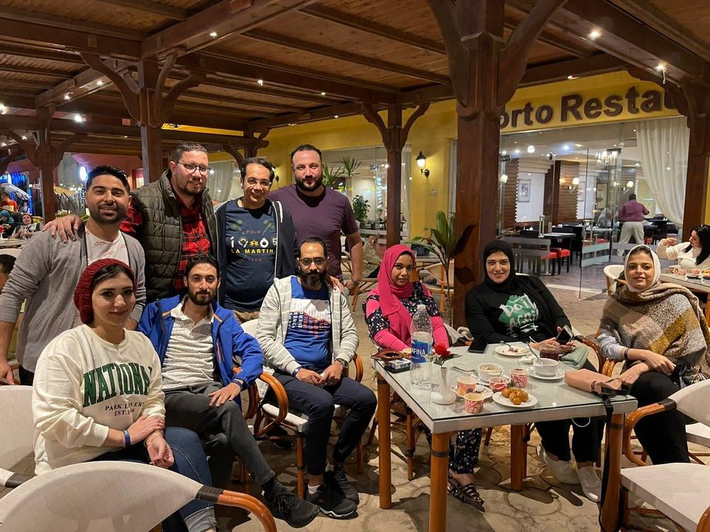 Planet Cure team together at dinner during a company offsite
